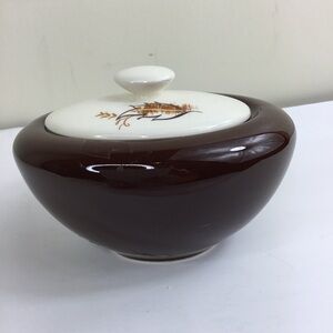 Small Brown Pottery Bowl White Lid With Brown Leaves. Condition is "Used